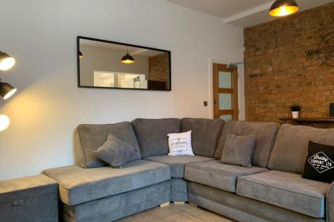 Modern and stylish living room featuring a larg...