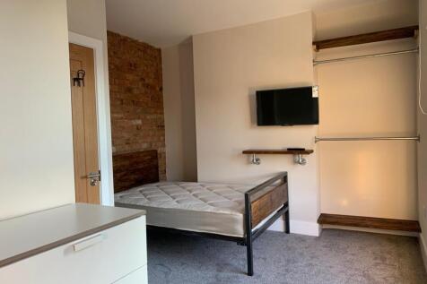 A cozy bedroom with a comfortable bed, a mounte...