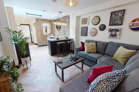 A spacious, well-lit living room with contempor...