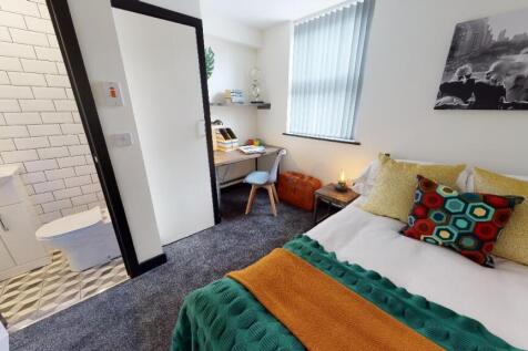 A bright and inviting double bedroom featuring ...