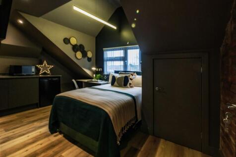 Modern and stylish bedroom with a cozy double b...