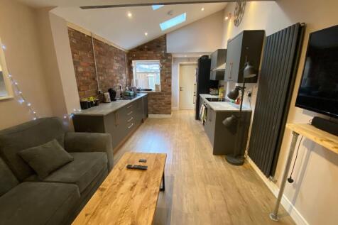 A spacious and modern living room with contempo...