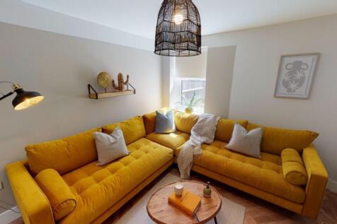 Bright and stylish living room featuring a vibr...