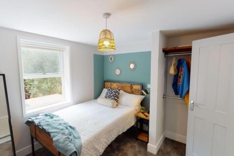 Bright and welcoming bedroom featuring a large ...