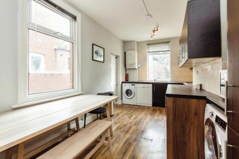 Bright and clean kitchen area with large window...