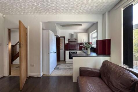 A bright and inviting living room with large wi...