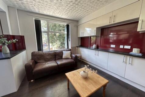 A bright and inviting living room featuring a c...