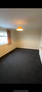 Bright and welcoming living room with natural l...