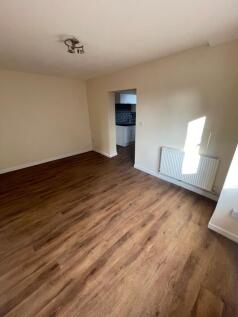 Bright and spacious living room with natural li...