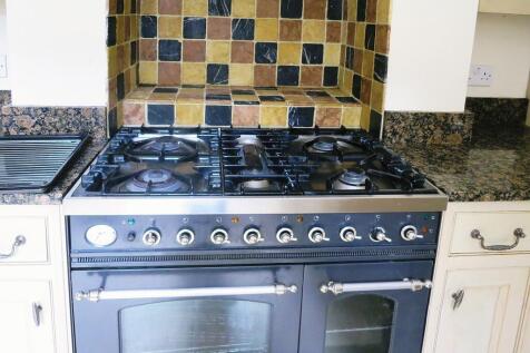 A modern kitchen featuring a stainless steel ga...