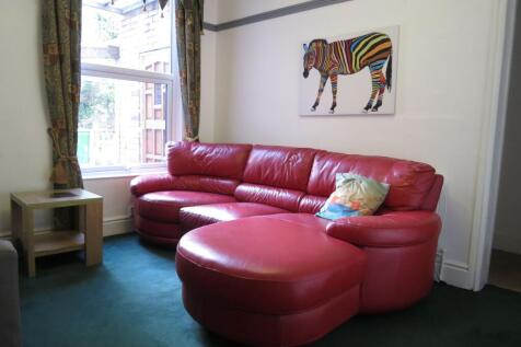 Bright and welcoming living room featuring a la...