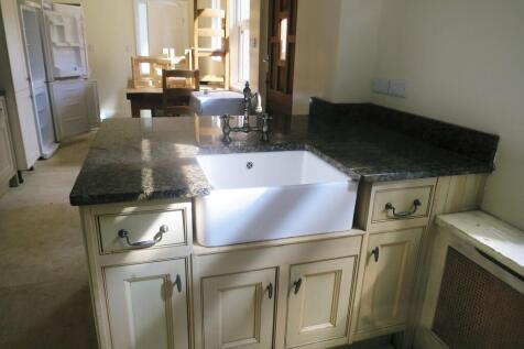 A well-maintained kitchen featuring a large gra...