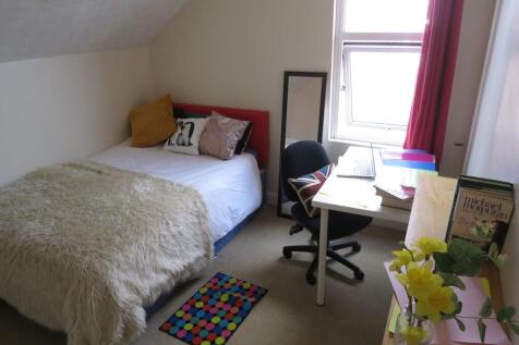 Cozy bedroom with a comfortable bed adorned wit...