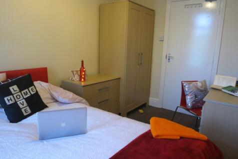 A comfortable bedroom featuring a double bed wi...