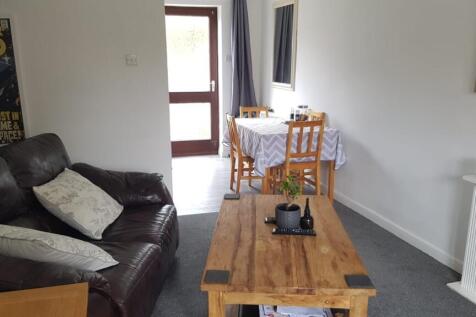 Bright and welcoming living room featuring a co...