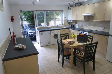 Bright and spacious kitchen with large windows ...