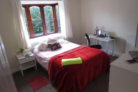 Bright and welcoming bedroom featuring a large ...