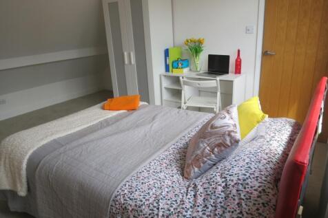 A bright and inviting double bedroom featuring ...