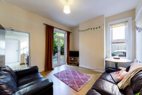 Bright and welcoming living room featuring larg...