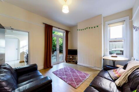 Bright and welcoming living room with ample nat...