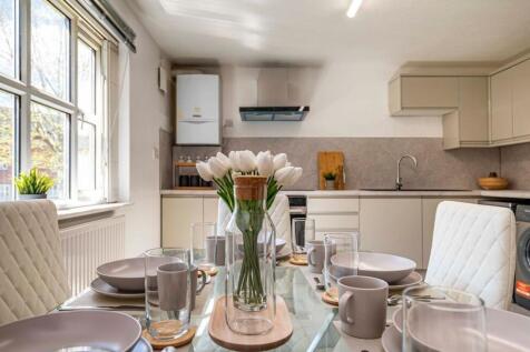 Bright, modern kitchen-diner with a set dining ...