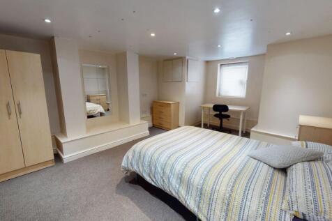 A well-maintained bedroom featuring a double be...