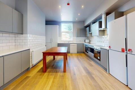 Bright and modern kitchen with ample natural li...