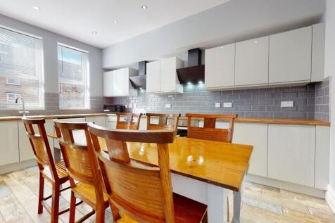 Bright and modern kitchen with ample natural li...