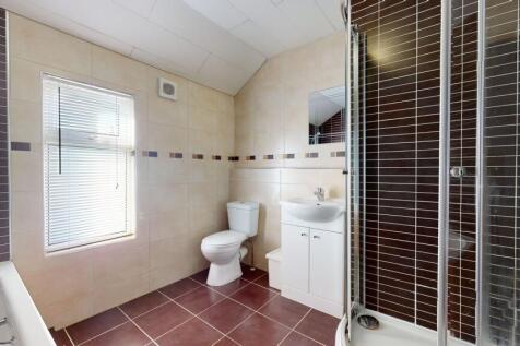Bright and well-maintained bathroom featuring a...