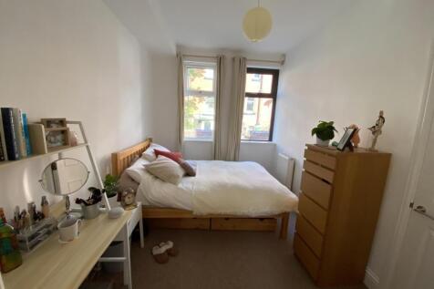 Bright, neatly presented bedroom with a double ...