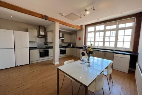 Bright and spacious kitchen with large windows ...