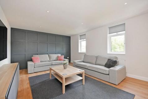 Bright and inviting living room featuring two c...