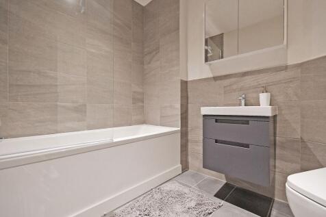 Modern and clean bathroom featuring a spacious ...