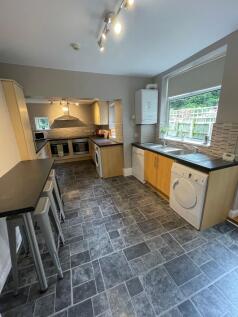 A bright and well-maintained kitchen featuring ...