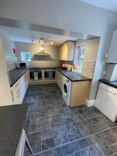 A modern kitchen with ample counter space, slee...