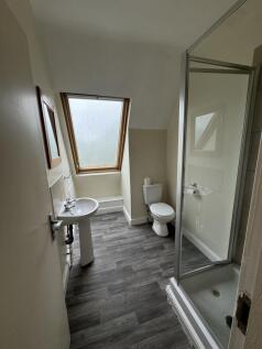 Bright and functional bathroom featuring a toil...