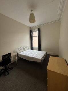 A tidy and well-maintained student bedroom feat...