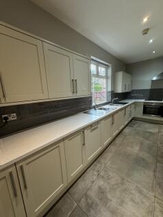 Modern, well-maintained kitchen with ample crea...