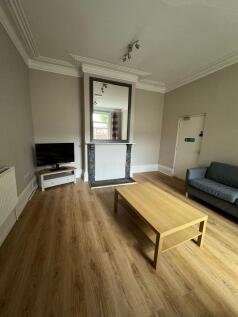 A spacious and well-maintained living room feat...