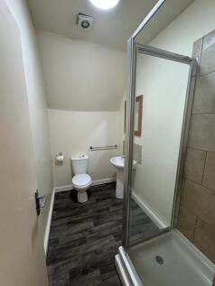 A clean, well-maintained bathroom featuring a t...