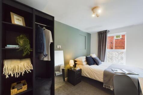 A spacious and well-maintained master bedroom f...