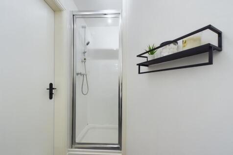 A clean and modern bathroom suite featuring a l...
