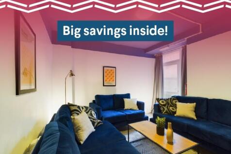 A modern, spacious living room featuring stylis...