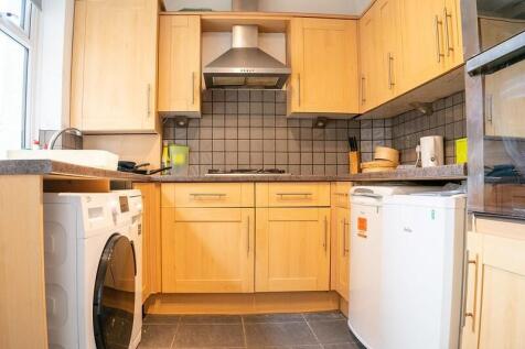 A well-maintained kitchen featuring wooden cabi...