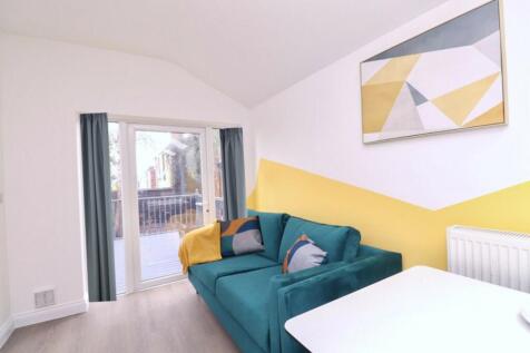 A bright and inviting living room featuring mod...