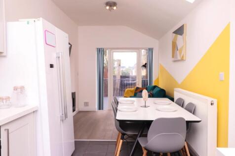 A bright and modern kitchenette with a stylish ...