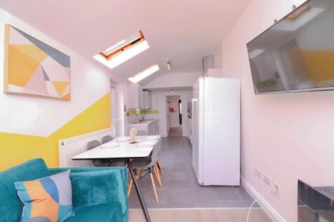 A bright and modern kitchenette with ample spac...