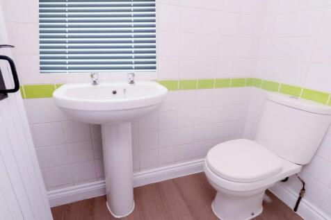 A bright and clean bathroom featuring modern fi...
