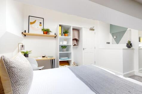 A bright and inviting double bedroom featuring ...