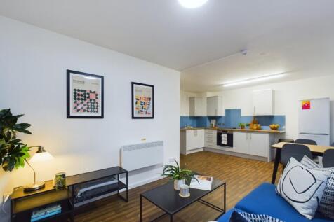 A bright and inviting large modern living room ...